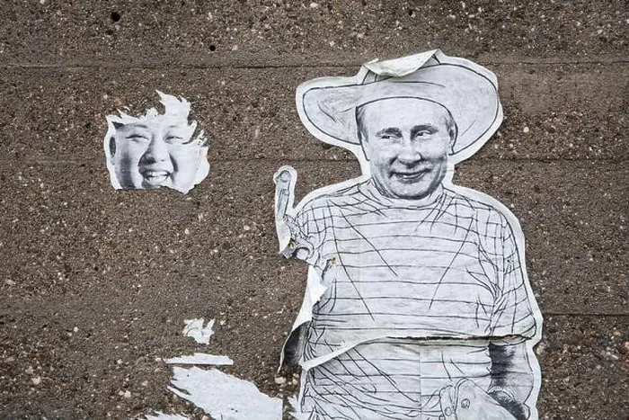 Framed Print : remains of a poster with Kim Jong-un and Vladimir Putin on a wall in the Deutz district Framed Print : remains of a poster with Kim Jong-un and Vladimir Putin on a wall in the Deutz district