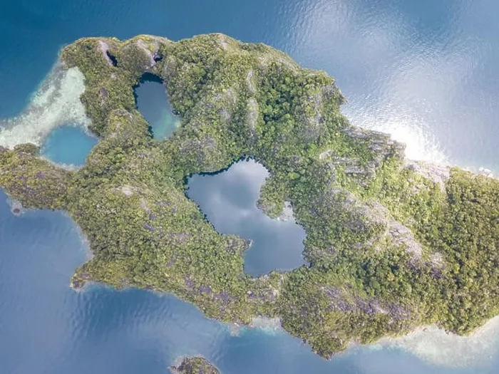 Framed Print : The remote limestone islands of Misool in Raja Ampat are surrounded by calm seas and healthy reefs. This tropical region has high marine biodiversity
