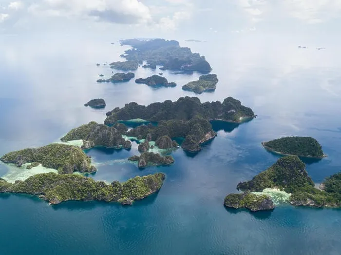 Framed Print : The remote limestone islands of Misool in Raja Ampat are surrounded by calm seas and healthy reefs. This tropical region has high marine biodiversity Framed Print : The remote limestone islands of Misool in Raja Ampat are surrounded by calm seas and healthy reefs. This tropical region has high marine biodiversity