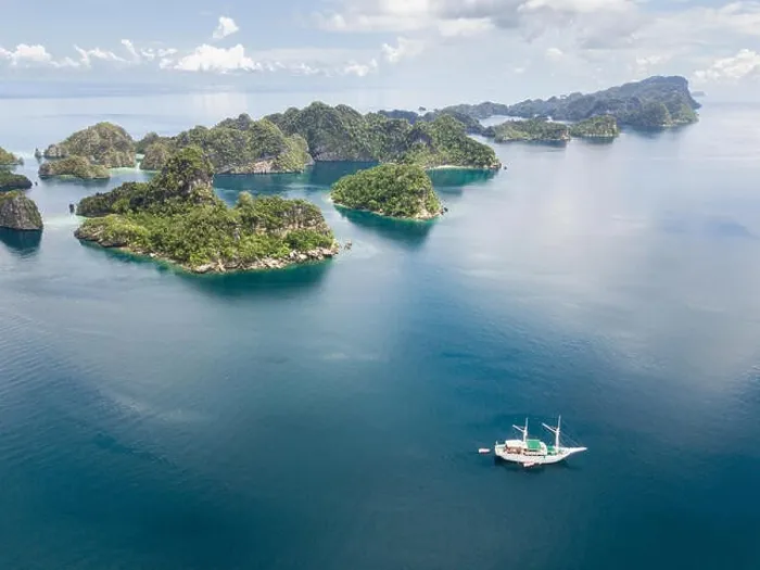 Framed Print : The remote limestone islands of Misool in Raja Ampat are surrounded by calm seas and healthy reefs. This tropical region has high marine biodiversity Framed Print : The remote limestone islands of Misool in Raja Ampat are surrounded by calm seas and healthy reefs. This tropical region has high marine biodiversity