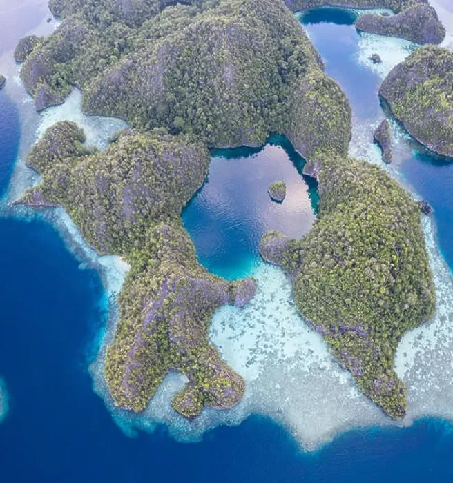 Framed Print : Remote limestone islands in Raja Ampat, Indonesia, are surrounded by healthy coral reefs. This biodiverse region is known for its marine biodiversity Framed Print : Remote limestone islands in Raja Ampat, Indonesia, are surrounded by healthy coral reefs. This biodiverse region is known for its marine biodiversity