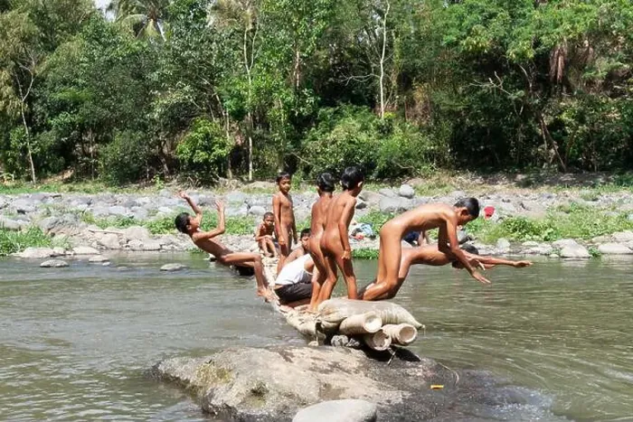 Framed Print : Residents in Taman Krocok village, Bondowoso, use the river for bathing and for playing Framed Print : Residents in Taman Krocok village, Bondowoso, use the river for bathing and for playing