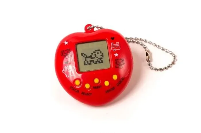 Framed Print : Retro virtual pet care game tamagotchi from 90's isolated on the white background Framed Print : Retro virtual pet care game tamagotchi from 90's isolated on the white background