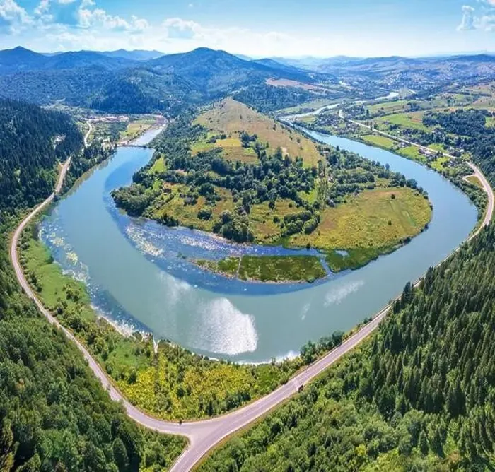 Framed Print : River meander in a mountain valley in summer. Drone view Framed Print : River meander in a mountain valley in summer. Drone view