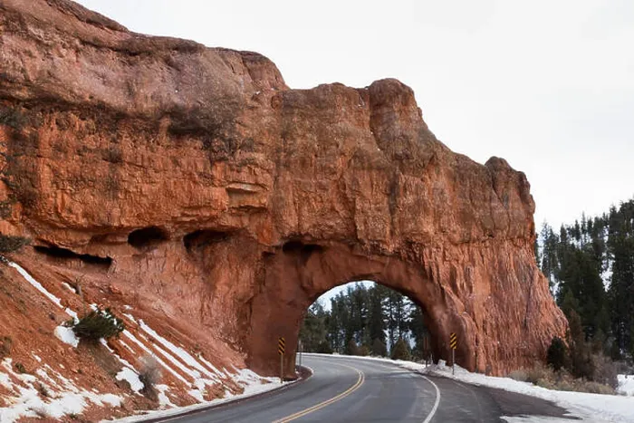 Framed Print : A road built through a natural sandstone bridge in Red Canyon, Dixie National Forest, Utah Framed Print : A road built through a natural sandstone bridge in Red Canyon, Dixie National Forest, Utah