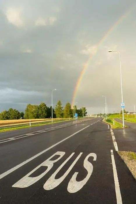 Framed Print : Road with bus lane marking under rainbow after rain in Estonia Framed Print : Road with bus lane marking under rainbow after rain in Estonia
