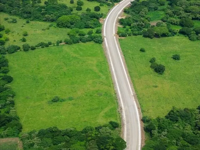Framed Print : Road in green natural field landscape aerial drone view Framed Print : Road in green natural field landscape aerial drone view