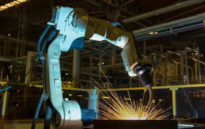 Framed Print : Robot is welding part in automotive factory Framed Print : Robot is welding part in automotive factory