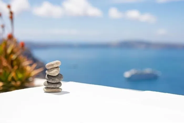Framed Print : Rock zen pyramid of stones pebbles on the background of the sea and boat. Concept of Life balance, harmony and meditation. Pyramid of sea pebbles Framed Print : Rock zen pyramid of stones pebbles on the background of the sea and boat. Concept of Life balance, harmony and meditation. Pyramid of sea pebbles