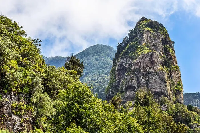 Framed Print : Rocks in green mountain with clouds in sky. Tenerife Canary island, Spain Framed Print : Rocks in green mountain with clouds in sky. Tenerife Canary island, Spain