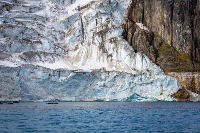 Framed Print : rocks waterfall small iceberg and glacier at the Alkefjellet between Spitsbergen and Nordaustlandet on Svalbard, Norway Framed Print : rocks waterfall small iceberg and glacier at the Alkefjellet between Spitsbergen and Nordaustlandet on Svalbard, Norway