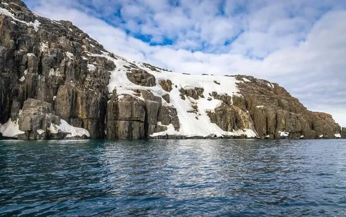 Framed Print : rocks waterfall small iceberg and glacier at the Alkefjellet between Spitsbergen and Nordaustlandet on Svalbard, Norway Framed Print : rocks waterfall small iceberg and glacier at the Alkefjellet between Spitsbergen and Nordaustlandet on Svalbard, Norway