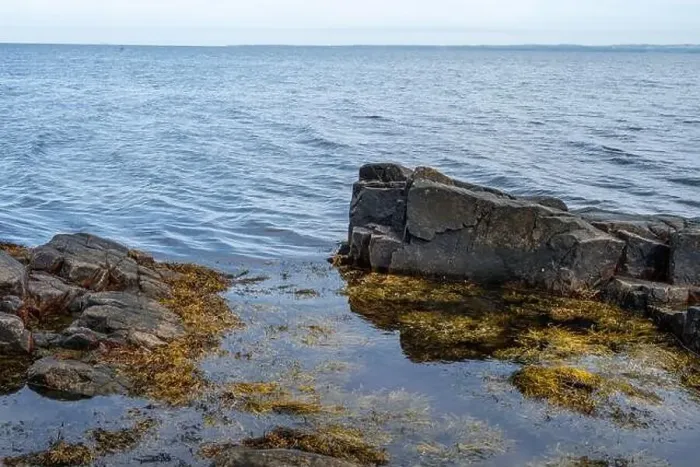 Framed Print : A rocky shoreline with blue water and a blu sky in the background. Picture from Skalderviken, southern Sweden Framed Print : A rocky shoreline with blue water and a blu sky in the background. Picture from Skalderviken, southern Sweden