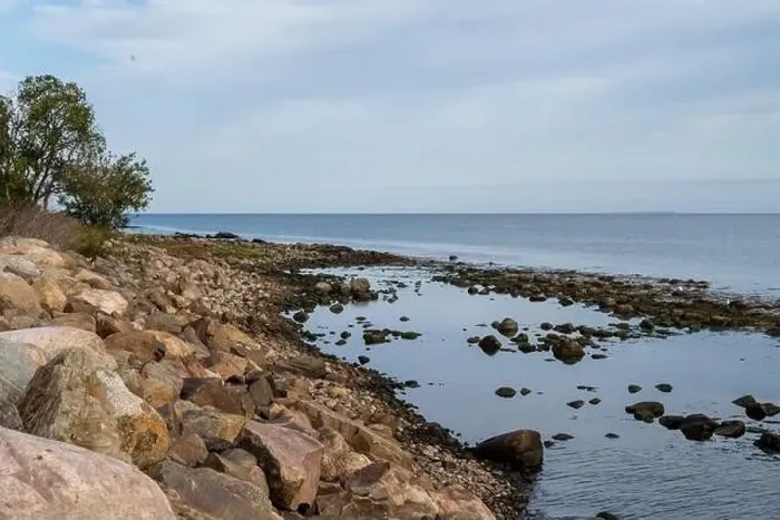 Framed Print : A rocky shoreline with blue water and a blu sky in the background. Picture from Skalderviken, southern Sweden Framed Print : A rocky shoreline with blue water and a blu sky in the background. Picture from Skalderviken, southern Sweden