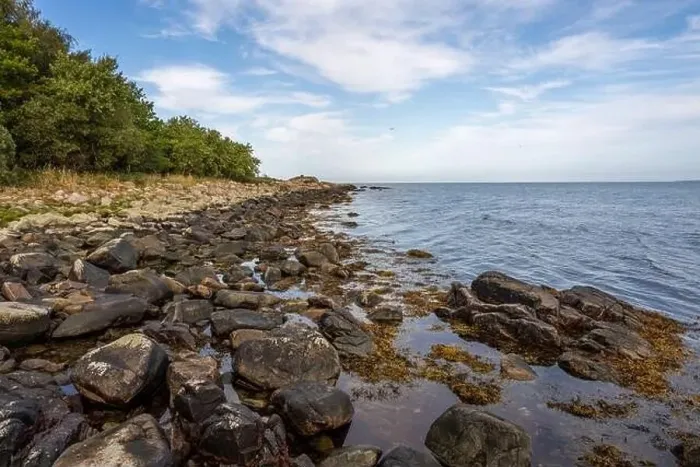 Framed Print : A rocky shoreline with blue water and a blu sky in the background. Picture from Skalderviken, southern Sweden Framed Print : A rocky shoreline with blue water and a blu sky in the background. Picture from Skalderviken, southern Sweden