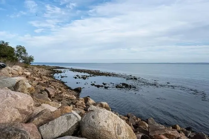 Framed Print : A rocky shoreline with blue water and a blu sky in the background. Picture from Skalderviken, southern Sweden Framed Print : A rocky shoreline with blue water and a blu sky in the background. Picture from Skalderviken, southern Sweden