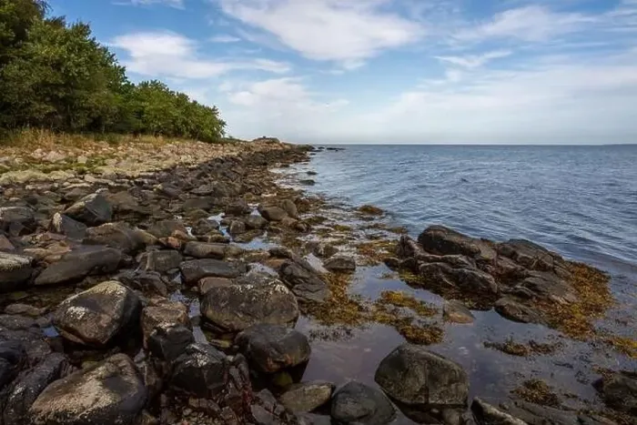 Framed Print : A rocky shoreline with blue water and a blu sky in the background. Picture from Skalderviken, southern Sweden Framed Print : A rocky shoreline with blue water and a blu sky in the background. Picture from Skalderviken, southern Sweden