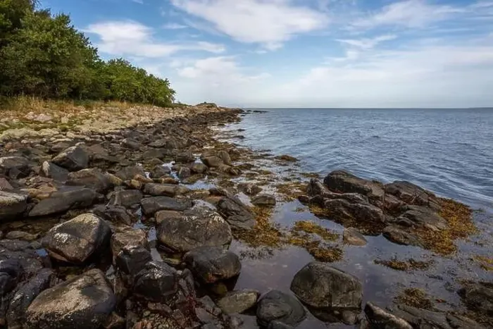 Framed Print : A rocky shoreline with blue water and a blu sky in the background. Picture from Skalderviken, southern Sweden Framed Print : A rocky shoreline with blue water and a blu sky in the background. Picture from Skalderviken, southern Sweden