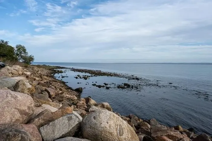 Framed Print : A rocky shoreline with blue water and a blu sky in the background. Picture from Skalderviken, southern Sweden Framed Print : A rocky shoreline with blue water and a blu sky in the background. Picture from Skalderviken, southern Sweden