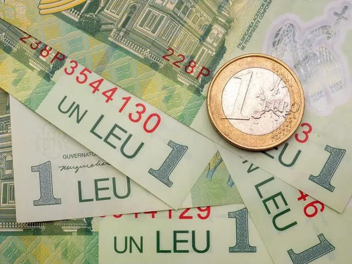 Framed Print : The Romanian one leu banknotes and a one euro coin Framed Print : The Romanian one leu banknotes and a one euro coin