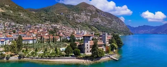 Framed Print : Romantic beautiful lake Iseo, aerial view of Predore idyllic village surrounded by mountains. Italy, Bergamo province Framed Print : Romantic beautiful lake Iseo, aerial view of Predore idyllic village surrounded by mountains. Italy, Bergamo province