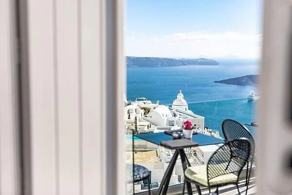 Romantic two chairs and a table on the terrace, Santorini island Greece. Summer vibes with white architecture and sea view. Luxury travel background