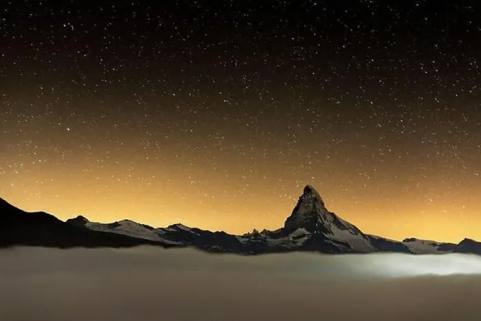 Framed Print : Romantic night sky with stars over Matterhorn emerging from fog, Zermatt, Valais canton, Switzerland Framed Print : Romantic night sky with stars over Matterhorn emerging from fog, Zermatt, Valais canton, Switzerland