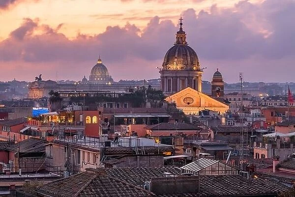 Rome, Italy rooftop skyline at dusk with the Vatican in the distance