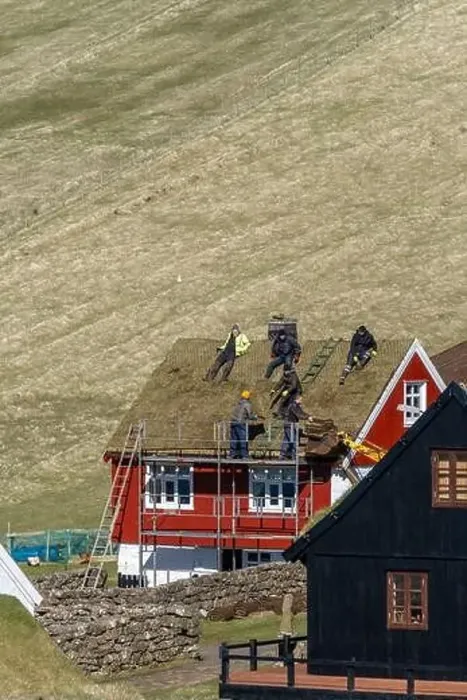 Framed Print : The roofers taking a rest on top of the roof of a house in Faroe Islands Framed Print : The roofers taking a rest on top of the roof of a house in Faroe Islands