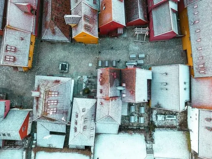 Framed Print : Roofs Covered with Snow. Aerial View