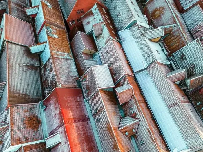 Framed Print : Roofs Covered with Snow. Aerial View
