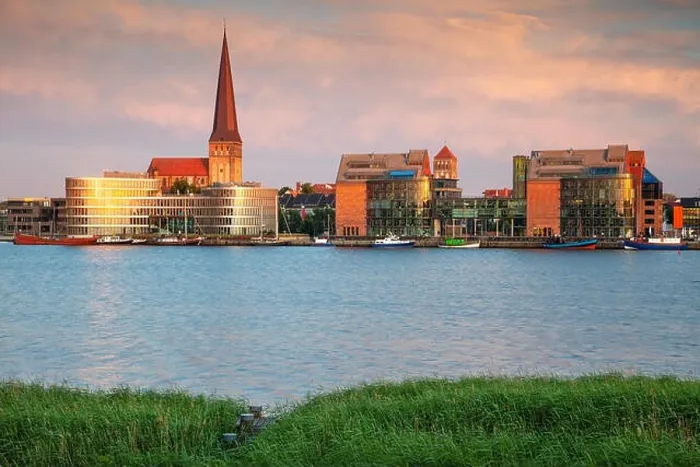 Framed Print : Rostock, Germany. Cityscape image of Rostock riverside with St. Peter's Church during summer sunset