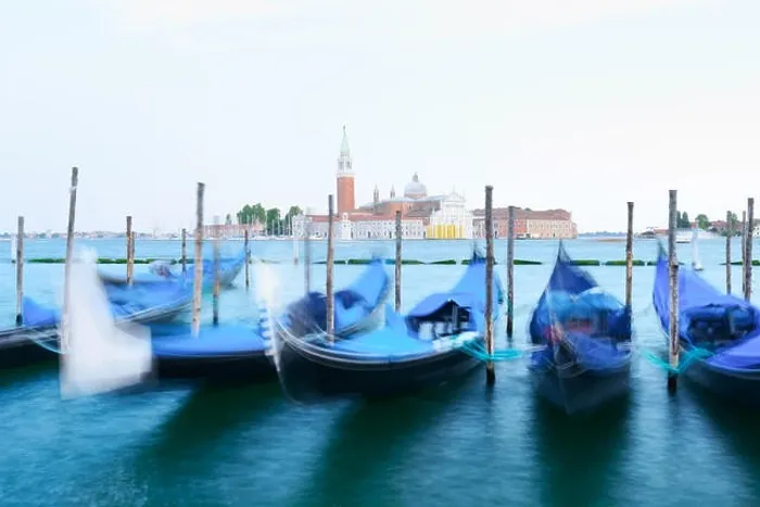 Framed Print : Row of gondolas parked on city pier Framed Print : Row of gondolas parked on city pier