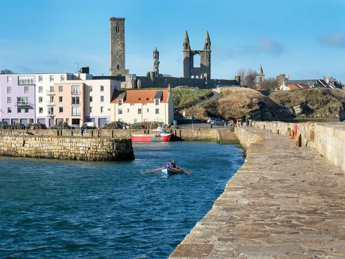 Framed Print : Rowing boat entering St Andrews Harbour on a sunny spring morning St Andrews Fife Scotland Framed Print : Rowing boat entering St Andrews Harbour on a sunny spring morning St Andrews Fife Scotland