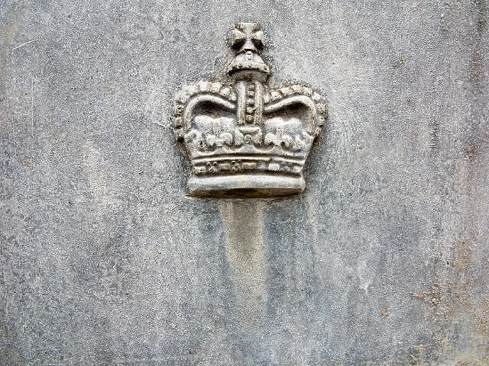 Framed Print : A Royal Crown motif cast in lead on the side of a lead planter Framed Print : A Royal Crown motif cast in lead on the side of a lead planter