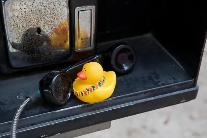 Framed Print : Rubber duck talking on a pay phone Framed Print : Rubber duck talking on a pay phone