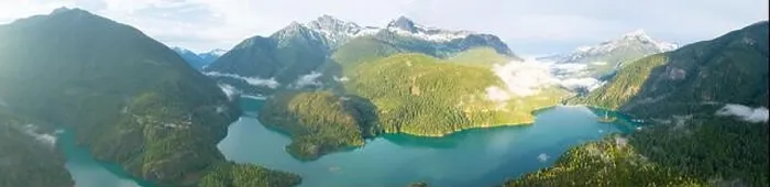 Framed Print : Rugged, forest-covered landscape surrounds Diablo Lake in North Cascades National Park. This mountainous region in Washington is absolutely beautiful Framed Print : Rugged, forest-covered landscape surrounds Diablo Lake in North Cascades National Park. This mountainous region in Washington is absolutely beautiful