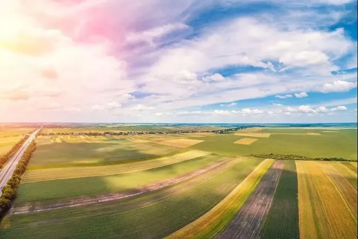 Framed Print : Rural landscape with a beautiful sky. Aerial view. View of colorful arable fields in summer Framed Print : Rural landscape with a beautiful sky. Aerial view. View of colorful arable fields in summer