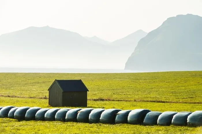 Framed Print : Rural scene with farm field and hay stacks on the Faroe Islands Framed Print : Rural scene with farm field and hay stacks on the Faroe Islands