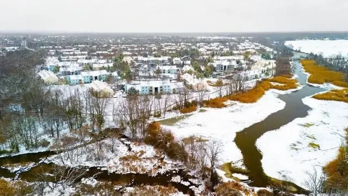 Framed Print : Rural winter aerial view of countryside village at the river covered with snow Framed Print : Rural winter aerial view of countryside village at the river covered with snow