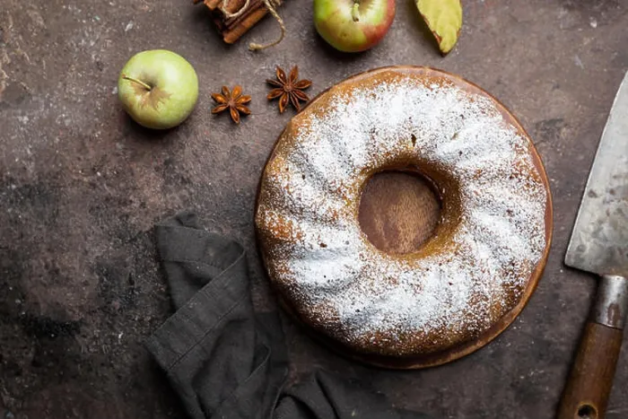 Framed Print : Rustic Style Apple Bundt Cake Sprinkled with Icing Sugar on old wooden table, top view Framed Print : Rustic Style Apple Bundt Cake Sprinkled with Icing Sugar on old wooden table, top view