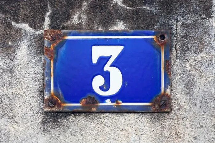 Framed Print : Rusty blue street plate on a white wall with a number 3 painted in white in the middle Framed Print : Rusty blue street plate on a white wall with a number 3 painted in white in the middle