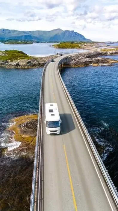 Framed Print : An RV drives along the scenic Atlantic Ocean Road in Norway