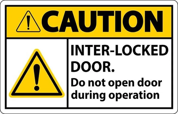 Framed Print : Safety sign caution Interlock doors do not open door during operation Framed Print : Safety sign caution Interlock doors do not open door during operation