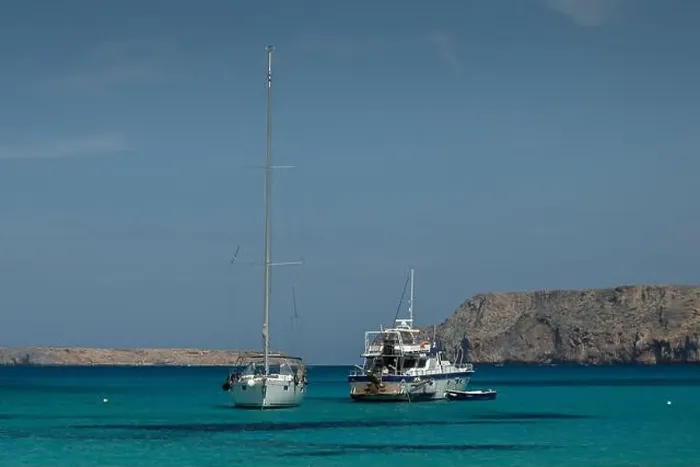 Framed Print : Two sailboats anchored in the clear blue waters of Gramvousa Framed Print : Two sailboats anchored in the clear blue waters of Gramvousa