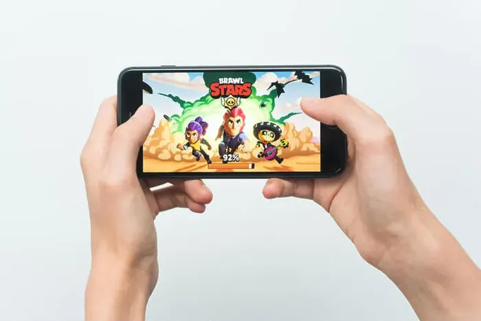 Framed Print : Samara, Russia -07, 29, 2019: A young guy playing brawl stars game on Iphone 8 Plus Framed Print : Samara, Russia -07, 29, 2019: A young guy playing brawl stars game on Iphone 8 Plus