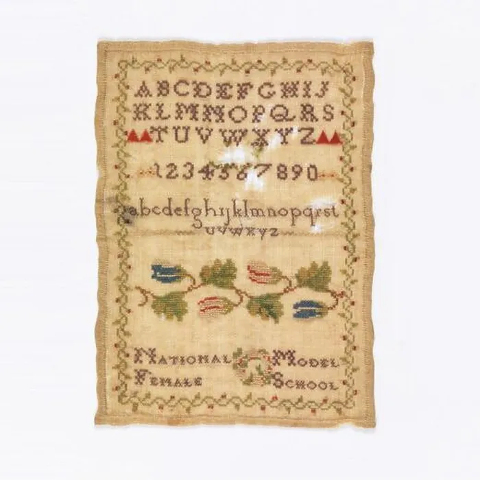 Framed Print : Sampler. Alphabets, numerals, floral cross border and text Framed Print : Sampler. Alphabets, numerals, floral cross border and text