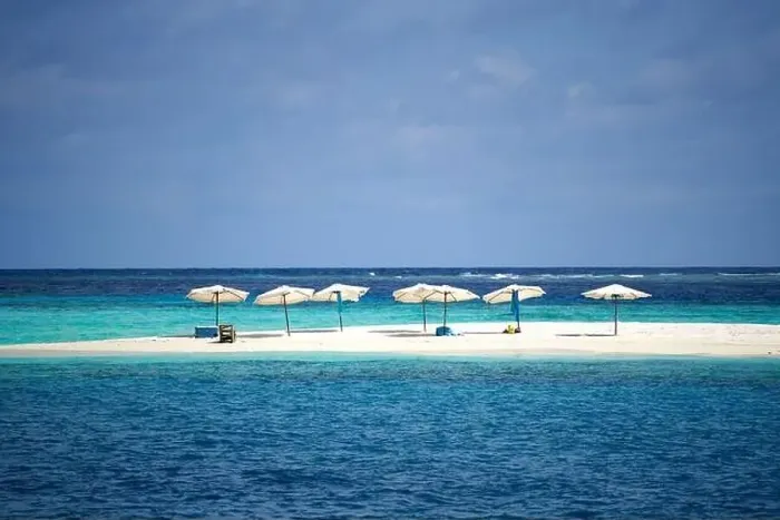 Framed Print : Sand bank with umbrellas in Maldives Framed Print : Sand bank with umbrellas in Maldives