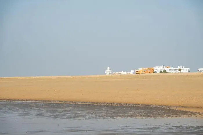 Framed Print : sand beach at Isla Cristina at the Costa de la Luz in Andalusia with view to town and lighthouse Framed Print : sand beach at Isla Cristina at the Costa de la Luz in Andalusia with view to town and lighthouse