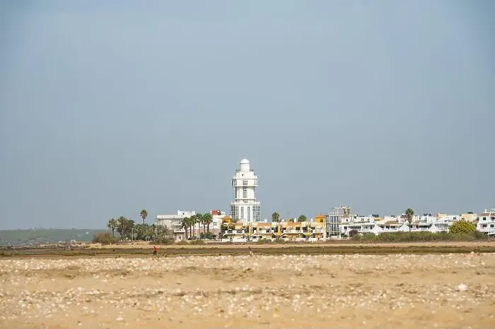 Framed Print : sand beach at Isla Cristina at the Costa de la Luz in Andalusia with view to town and lighthouse Framed Print : sand beach at Isla Cristina at the Costa de la Luz in Andalusia with view to town and lighthouse
